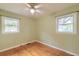 Simple bedroom with hardwood floors and natural light from two windows at 444 Clarine Dr, Goose Creek, SC 29445