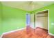 Bedroom showcasing hardwood floors, a ceiling fan, and two doors one of which has a closet at 444 Clarine Dr, Goose Creek, SC 29445