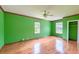 Bright bedroom features hardwood floors, multiple windows, and ample natural light, creating a warm and inviting space at 444 Clarine Dr, Goose Creek, SC 29445