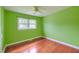 Bedroom with hardwood floors, ceiling fan, and a large window offering natural light at 444 Clarine Dr, Goose Creek, SC 29445