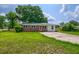 Inviting home boasts a brick facade and a well-maintained lawn, radiating curb appeal at 444 Clarine Dr, Goose Creek, SC 29445