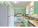 Efficient kitchen design featuring bright green cabinets and ample counter space at 444 Clarine Dr, Goose Creek, SC 29445