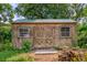 Exterior view of shed with double doors and windows, perfect for storage or a workshop at 444 Clarine Dr, Goose Creek, SC 29445