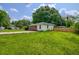 Exterior view showcasing the grassy side yard and access to the property at 444 Clarine Dr, Goose Creek, SC 29445