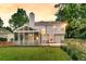 Backyard featuring a screened-in porch, wooden deck, and lush green lawn at 448 Jardinere Walk, Mount Pleasant, SC 29464