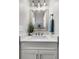 White bathroom sink with marble countertop, designer faucet and elegant mirror at 448 Jardinere Walk, Mount Pleasant, SC 29464