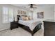 Bedroom featuring dark wood furniture, plush bedding, and abundant natural light at 448 Jardinere Walk, Mount Pleasant, SC 29464