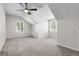 Spacious bonus room with multiple windows and plush neutral carpeting at 448 Jardinere Walk, Mount Pleasant, SC 29464
