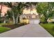 Charming two-story home with manicured lawn, mature trees, and an inviting front porch at 448 Jardinere Walk, Mount Pleasant, SC 29464