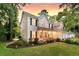 Two-story home with charming front porch, beautiful landscaping, and two-car garage at 448 Jardinere Walk, Mount Pleasant, SC 29464