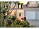 Lovely home showcasing a well-manicured garden and a two-car garage at 448 Jardinere Walk, Mount Pleasant, SC 29464