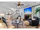 Bright living room with a fireplace, hardwood floors, and staircase access at 448 Jardinere Walk, Mount Pleasant, SC 29464