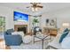 Inviting living room featuring a cozy fireplace, stylish furnishings, and natural light at 448 Jardinere Walk, Mount Pleasant, SC 29464