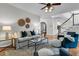 Comfortable living room with elegant decor, wood floors, and a staircase view at 448 Jardinere Walk, Mount Pleasant, SC 29464