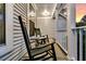 Front porch features rocking chairs, small table, and view of the home's exterior at 448 Jardinere Walk, Mount Pleasant, SC 29464