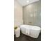 Sleek bathroom featuring a modern tub, stylish tile work, and a decorative stool for a spa-like experience at 4620 O'Hear Ave, North Charleston, SC 29405