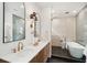 Bright bathroom with a double vanity, modern fixtures, and a glass-enclosed shower and tub combination at 4620 O'Hear Ave, North Charleston, SC 29405