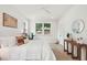 Bright bedroom with natural light features a white color palette and minimalist decor at 4620 O'Hear Ave, North Charleston, SC 29405
