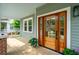 Inviting front door with glass panels, leading to a covered porch and the home's entrance at 4620 O'Hear Ave, North Charleston, SC 29405
