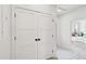 Hallway with closet space and patterned flooring, leading into a bedroom with natural light at 4620 O'Hear Ave, North Charleston, SC 29405