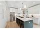 Bright kitchen with stainless steel appliances, a large center island, and white cabinetry for ample storage at 4620 O'Hear Ave, North Charleston, SC 29405