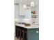 Kitchen island with white countertop, dark blue cabinets, and modern light fixture, and gas range stove at 4620 O'Hear Ave, North Charleston, SC 29405