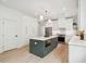 Kitchen boasts a central island, stainless steel appliances, white cabinets, and an efficient layout at 4620 O'Hear Ave, North Charleston, SC 29405