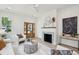 Bright living room featuring a fireplace, contemporary decor, and ample natural light at 4620 O'Hear Ave, North Charleston, SC 29405