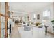 Bright and airy living room with a fireplace, opening to the kitchen and dining area at 4620 O'Hear Ave, North Charleston, SC 29405