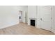 Bright living room with a fireplace and light wood floors, showcasing a modern and inviting space at 4620 O'Hear Ave, North Charleston, SC 29405