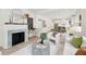 Open-concept living room showcasing a fireplace, modern furnishings, and seamless flow to other areas at 4620 O'Hear Ave, North Charleston, SC 29405