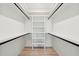 Spacious walk-in closet with built-in shelving and hanging rods, offering ample storage space at 4620 O'Hear Ave, North Charleston, SC 29405