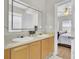 Well-lit bathroom with double vanity, and a view into the bedroom at 469 Hainsworth Dr, Charleston, SC 29414