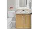 Bathroom with a neutral-toned vanity, a decorative red flower, and a lighted mirror creates a relaxing atmosphere at 469 Hainsworth Dr, Charleston, SC 29414