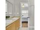 Bathroom featuring a double sink vanity, and a view into the bedroom at 469 Hainsworth Dr, Charleston, SC 29414