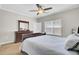 Bright bedroom with a ceiling fan, natural light, and wood floors at 469 Hainsworth Dr, Charleston, SC 29414