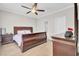 Primary bedroom showcasing wood furniture, ceiling fan, and private bath at 469 Hainsworth Dr, Charleston, SC 29414