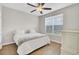 Bright bedroom with a ceiling fan, natural light, and wood floors at 469 Hainsworth Dr, Charleston, SC 29414
