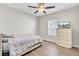 Cozy bedroom features a ceiling fan and a TV atop a dresser for entertainment, providing a comfortable retreat at 469 Hainsworth Dr, Charleston, SC 29414