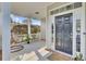 Inviting front porch featuring a comfortable swing chair and stylish decor at 469 Hainsworth Dr, Charleston, SC 29414