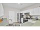 Open concept kitchen featuring stainless appliances and white cabinetry at 469 Hainsworth Dr, Charleston, SC 29414