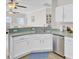 Well-lit kitchen with stainless dishwasher and view of Gathering room beyond half wall at 469 Hainsworth Dr, Charleston, SC 29414