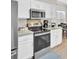 Kitchen featuring stainless appliances and white cabinets with bar seating at 469 Hainsworth Dr, Charleston, SC 29414