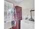 Functional laundry room includes washer, dryer, shelving, and a freezer at 469 Hainsworth Dr, Charleston, SC 29414