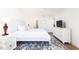 Bright bedroom with white furniture, woven headboard, and ample natural light at 509 Summerhouse, Isle of Palms, SC 29451