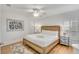Inviting bedroom featuring a king bed, coastal decor, and ceiling fan at 509 Summerhouse, Isle of Palms, SC 29451