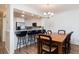 Open concept dining area with breakfast bar and modern lighting at 509 Summerhouse, Isle of Palms, SC 29451