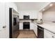 Updated kitchen with stainless steel appliances, granite countertops, and ample cabinet space at 509 Summerhouse, Isle of Palms, SC 29451
