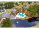 Aerial view of community pool, pond, clubhouse, playground and tennis court at 5135 Park Creek Ave, North Charleston, SC 29418