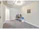 Versatile basement space ideal for a home gym or office, featuring a drop ceiling and carpet floors at 5135 Park Creek Ave, North Charleston, SC 29418